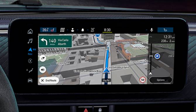 Car navigation system displaying a map with a route to Via Carlo Abarth.