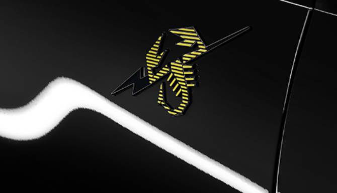Yellow and black scorpion emblem on a black surface.