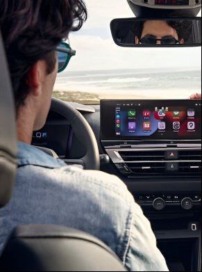 man in the front seat of the car
