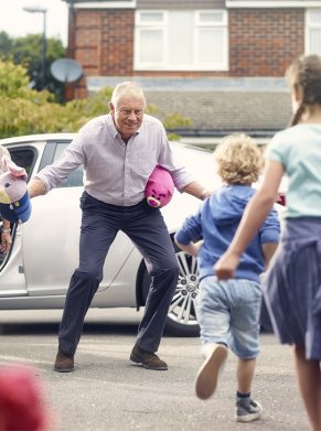 family welcoming each other outside of the car