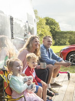 people sitting near car