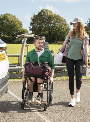 two people walking by the car