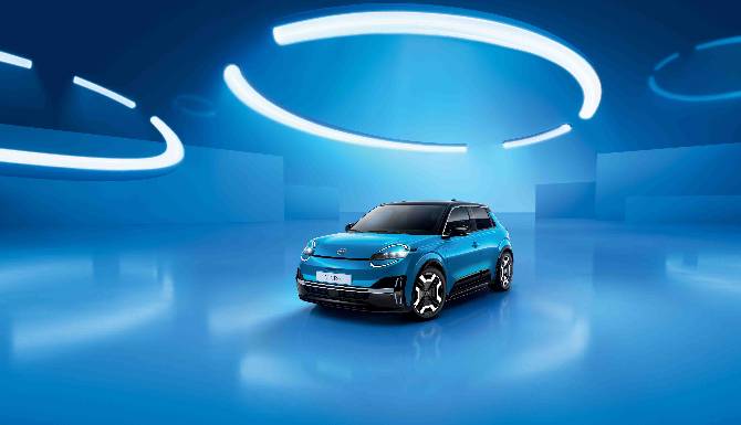A blue car on a blue reflective surface with circular white lights above.