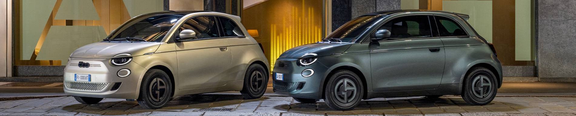 TWO FIAT IN front of shop