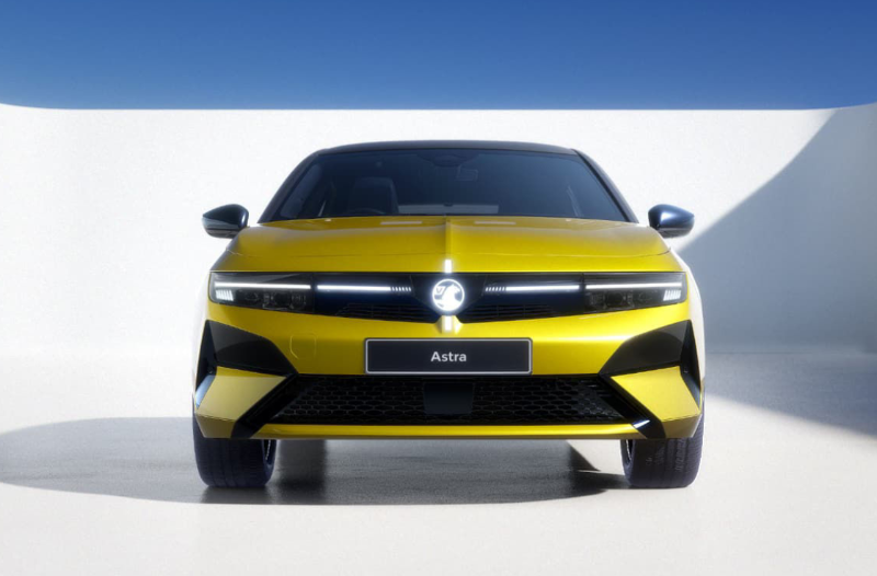 Front view of a yellow car labelled Astra.