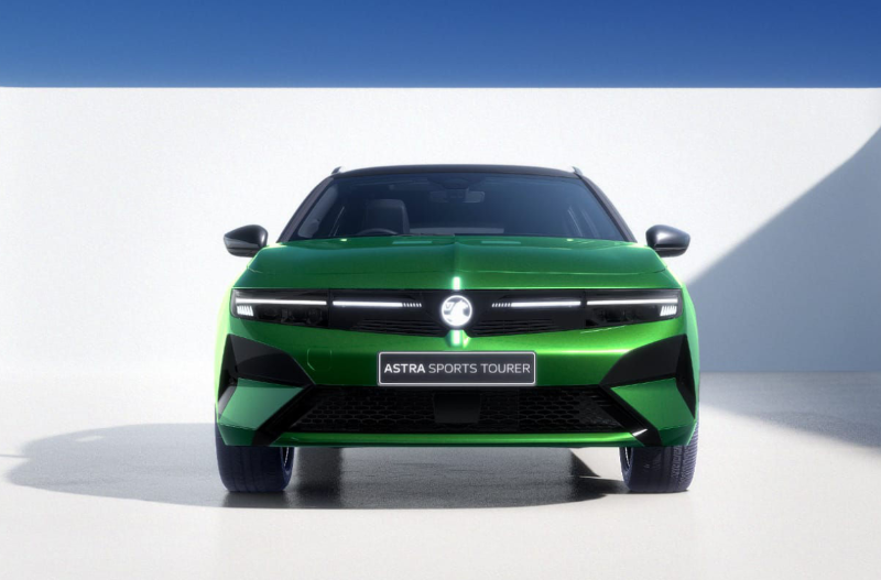 Green Astra Sports Tourer car viewed from the front.