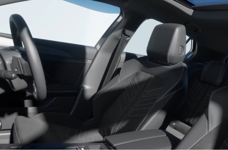 Interior of a car showing front seats, steering wheel, and sunroof.