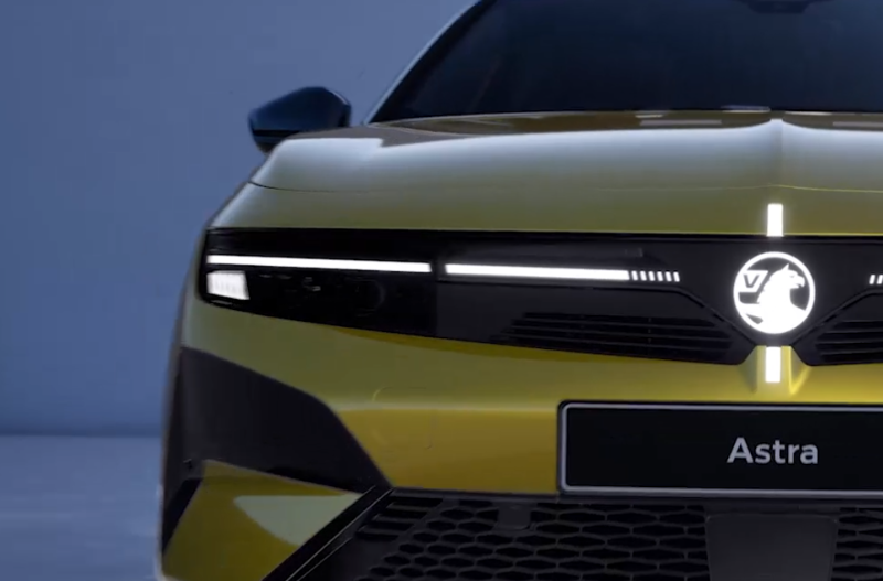Front view of a yellow car with Astra on the number plate.