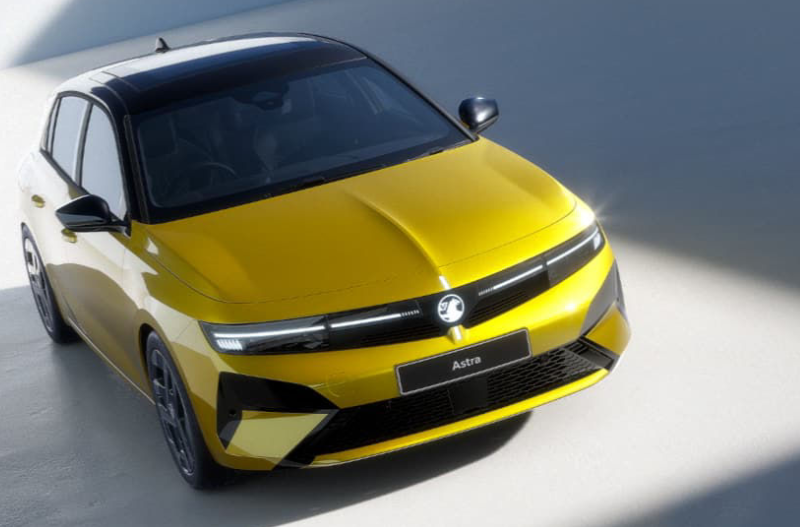 Yellow car with a black roof, viewed from above.