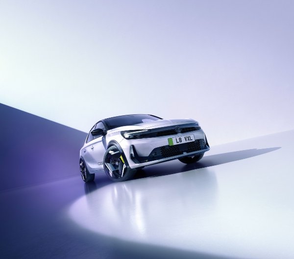 A white car with a shadow cast on a light background.
