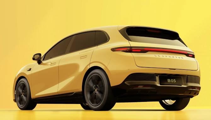 Yellow electric SUV, rear side view, with tinted windows and dark wheels.