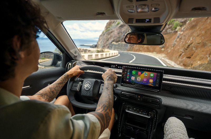 Dashboard of car with the man driving down the road
