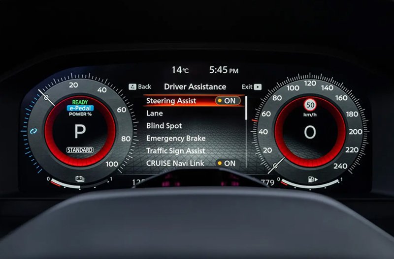 Car dashboard showing driver assistance features and speedometer.
