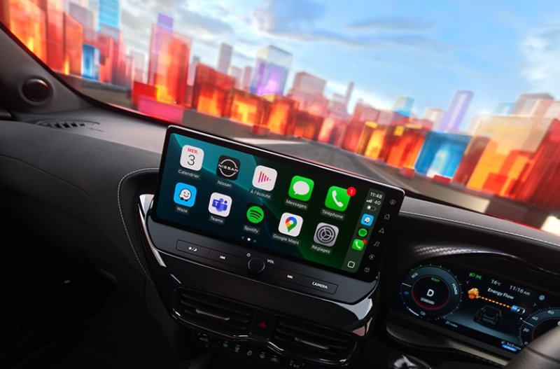 Car interior with touchscreen displaying app icons on the dashboard.