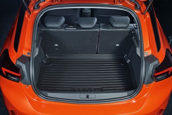 Open boot of an orange car showing rear seats and boot liner.