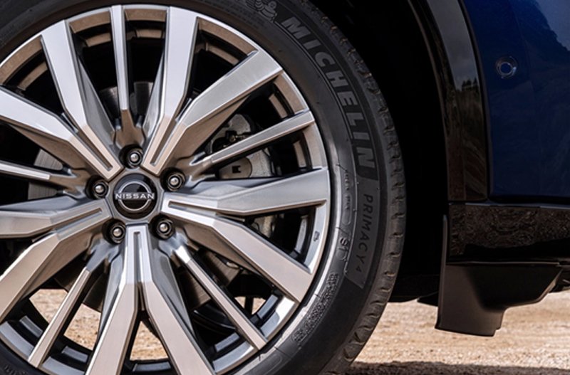 Close-up of a Nissan alloy wheel with a Michelin Primacy tyre.