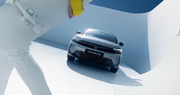 grey car with person walking past the camera