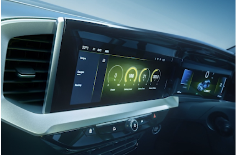 Car interior showing digital dashboard and control panel.