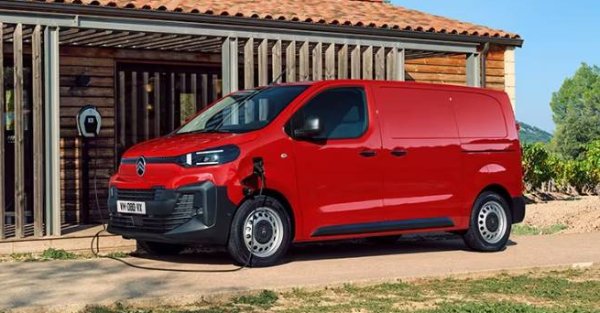 van parked on the outside of wooden building