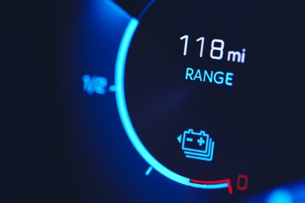 Digital car dashboard showing a battery range of 118 miles.