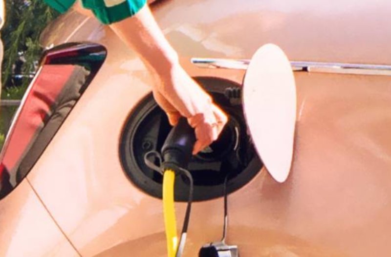 person plugging in car