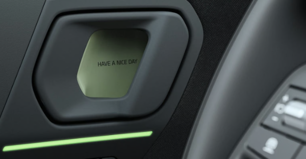 Car compartment with message Have a Nice Day and a green LED indicator light.