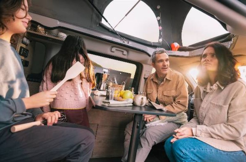 family eating and cooking inside of the citroen holidays