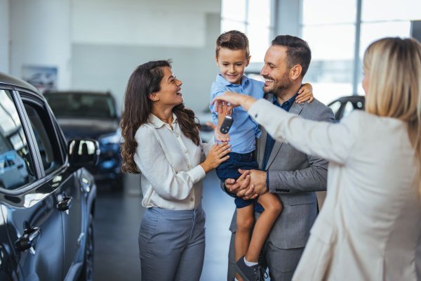 family of three collecting car