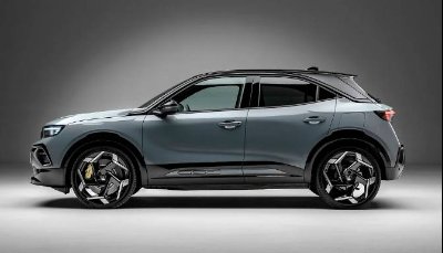 Side view of a modern grey SUV with distinctive alloy wheels.
