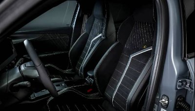 Front seats and dashboard of a modern car interior.