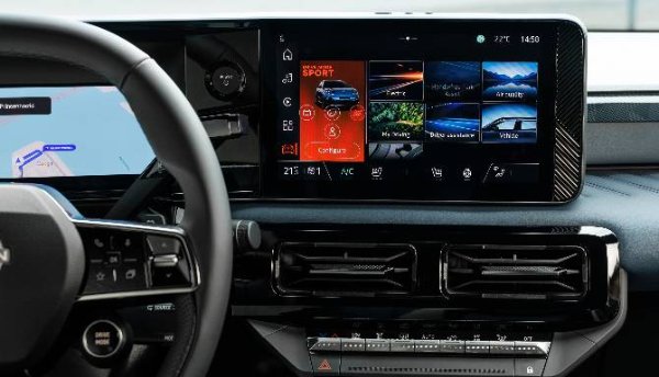 Car dashboard with digital display, steering wheel, and climate controls.