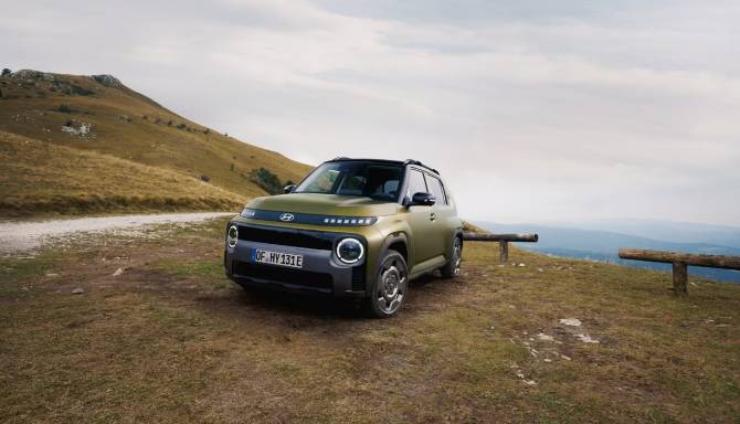 hyundai inster cross on a field background