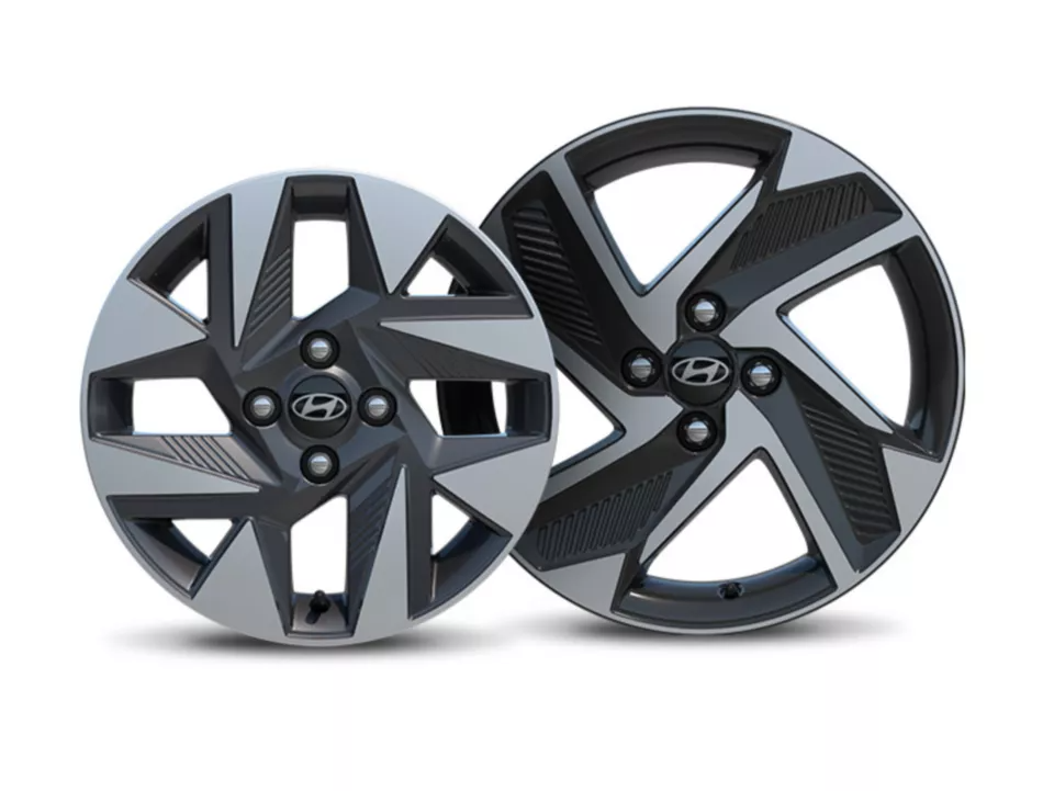 Two Hyundai alloy wheels with a geometric spoke design.