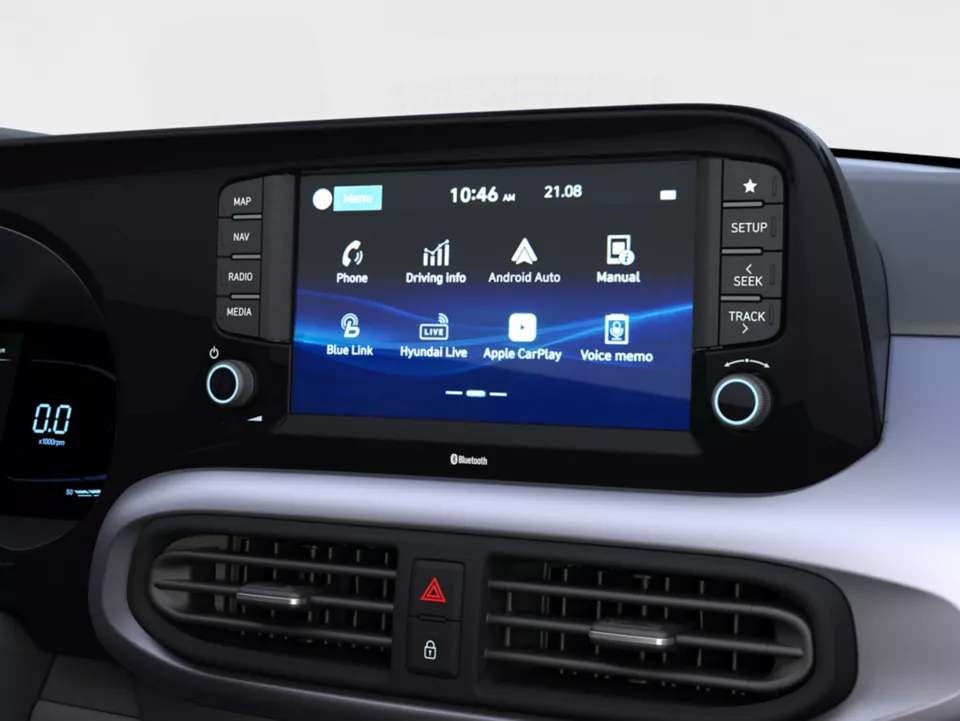 Car infotainment system display showing apps and controls.