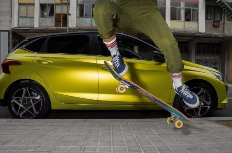 car parked with skate border in front