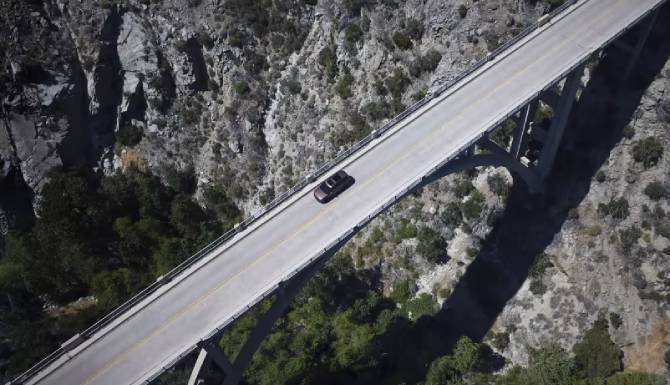 santa fe driving on a bridge