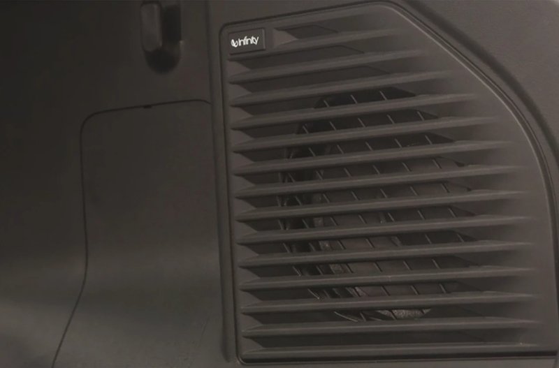 Close-up of a black Infinity speaker with horizontal slats.