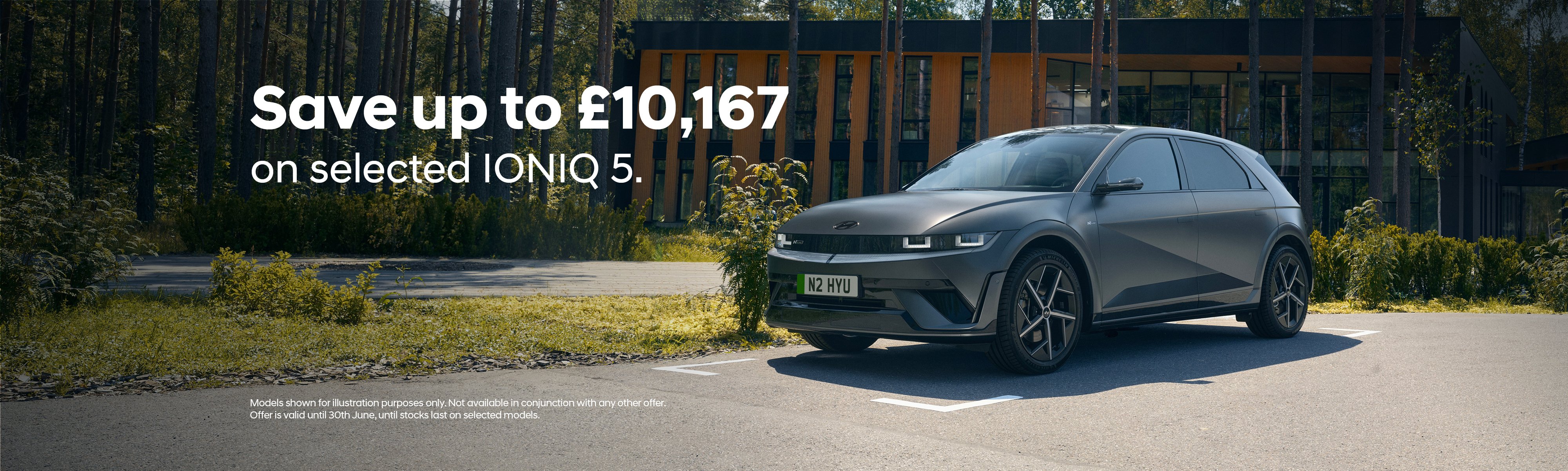 IONIQ 5 car parked with the text: Save up to £10,167 on selected IONIQ 5.