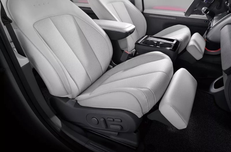 cream seats with black body, drivers side