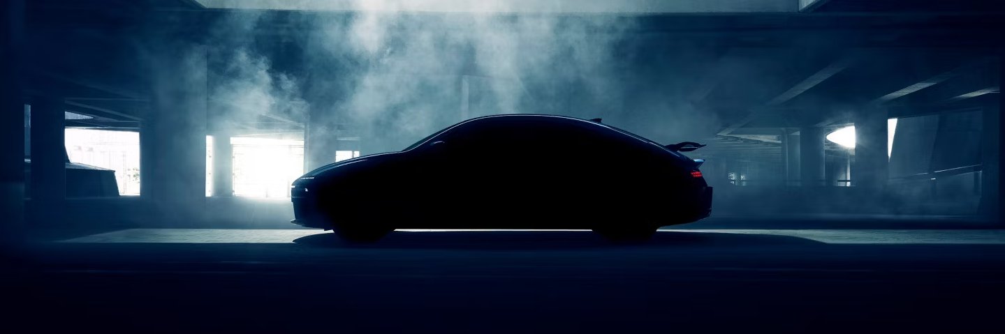 car parked in darkness with the smoke behind for the outline