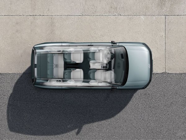 Top-down view of a car with interior seating layout visible.