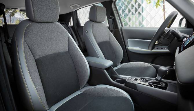 Front seats and dashboard of a modern car interior.