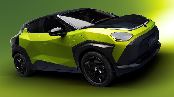 Green and black futuristic car viewed from the front left angle.