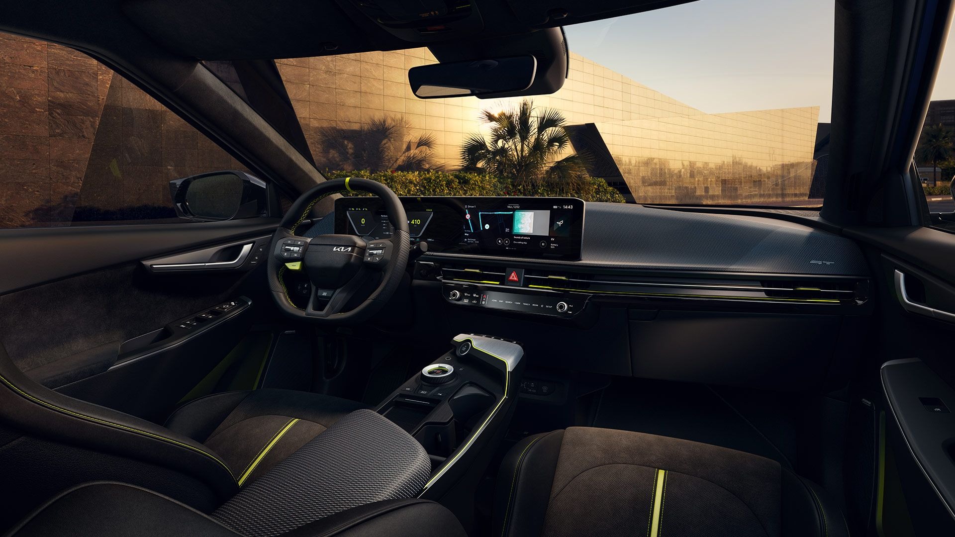 Interior view of a modern car dashboard and steering wheel with digital displays.