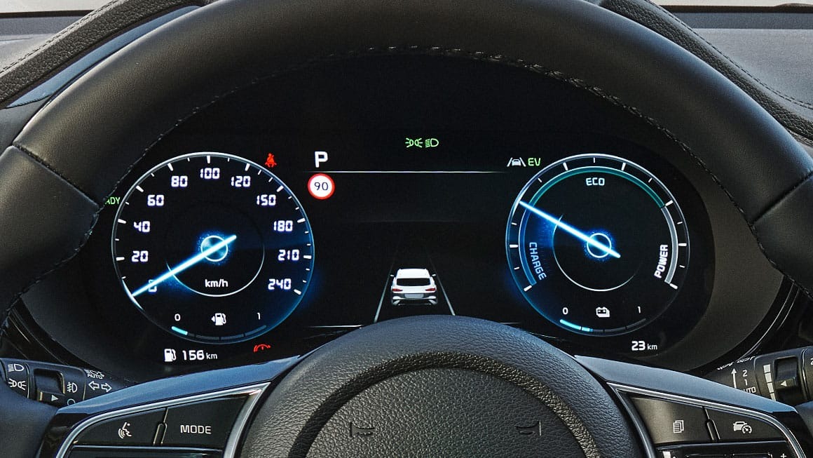Close-up of a car's digital dashboard showing speedometer and eco display.