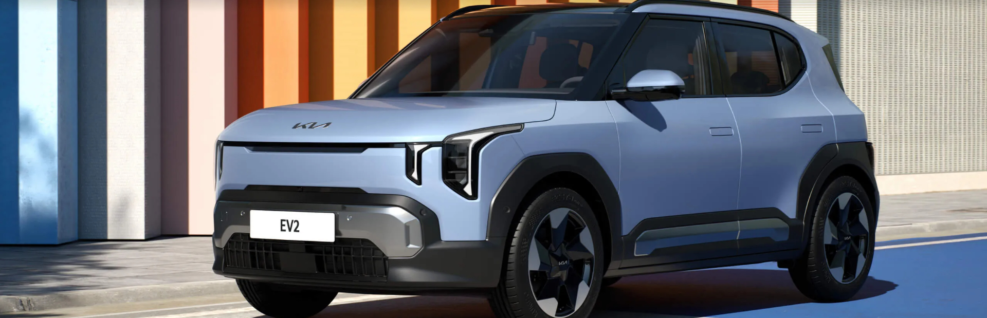 Silver electric SUV parked on the road with distinctive lighting design.