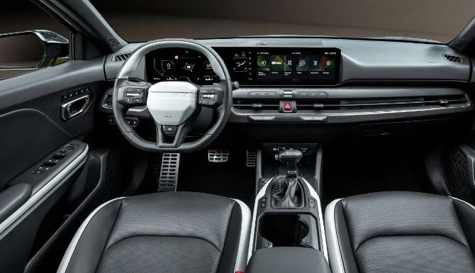 Car interior showing dashboard, steering wheel, and digital displays.