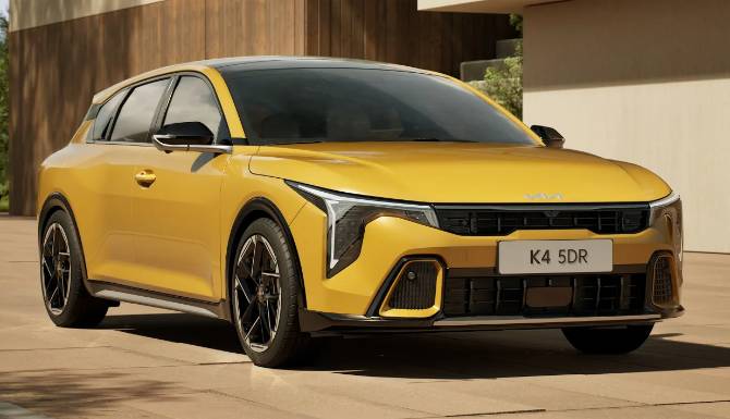 Yellow car with sporty design parked on a paved area.