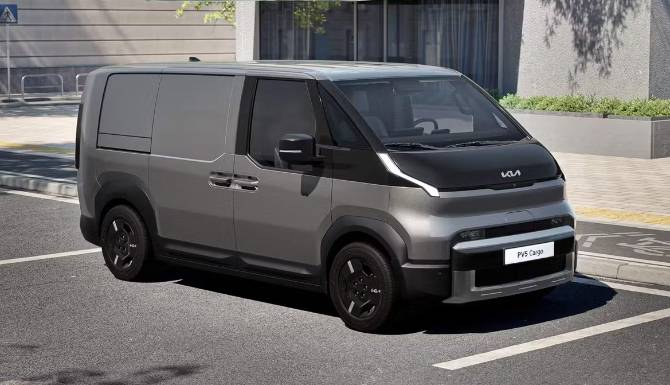 kia pv5 dark grey van in a parking space