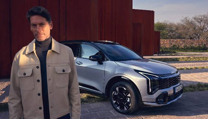 kia sportage with man in the foreground